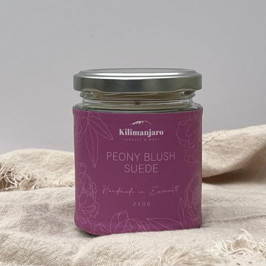 Peony blush and suede sustainable  candle 